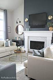 We live in a small 1970's ranch style home, so the ceilings are low (or average) and the rooms are small and closed off.i have found the best way to maximize flow is to keep the colors coordinating and palate neutral. Tall Fireplace Wall Transformation With Paint Feature Wall Living Room Accent Walls In Living Room Living Room With Fireplace