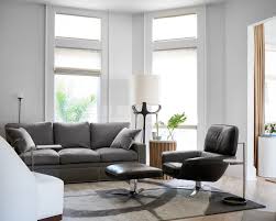 Panton chair in an open kitchen. Contemporary Living Room With White Walls And Dark Gray Sofa And Black Chair With Ottoman Hgtv