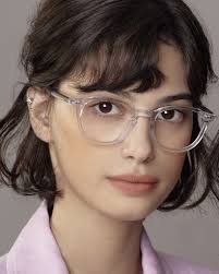 Add a pop of color to your look with the Bob frame from Manomos. Available  in clear, pink, and brown, these round acetate frames offer a playful yet  stylish edge. A perfect