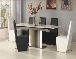 Here you can see the lovely black rectangular dining table that matches the dark tone of the stone fireplace. Timeless Black White Dining Room Designs For Glamorous Ambiance