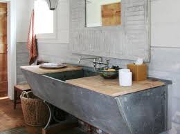 Here, a stainless steel framed mirror lends the bathing space a pop of polish. Diy Bathroom Ideas Vanities Cabinets Mirrors More Diy