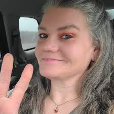 Na'ziyah Harris B/F/13 D.O.B. 09/16/2010 5'2” 130lbs medium complexion,  hair braided into two puff balls , wearing a light blue jean shirt, light  blue jean pants/Pink and White Rug Rat coat with