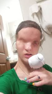 Parrot defends its owner from another bird