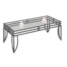 This exclusive occasional table makes a dynamic statement in front of the sofa while providing a convenient spot to place a glass, book or plant. Glass Top W Metal Finish Coffee Table 2 End Tables Aptdeco