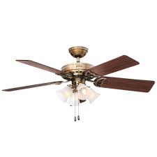 However, plenty of models exist without gaudy candelabra lights and annoying pull chains. Hunter Studio 52 In Indoor Antique Brass Ceiling Fan With Light Bundled With Handheld Remote Control 53063r The Home Depot