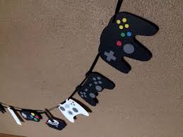 The best way to let your party shine is through your decorations. Gamer Party Decor Game Controller Decor Gaming Party Gamer Etsy Video Games Birthday Party Video Game Party Xbox Birthday Party