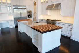 The dark brown wooden floor, black chair, and white tables. Dark Floor Cabinets Above Walk Fridge Dark Kitchen Floors Kitchen Cabinet Design Kitchen Design