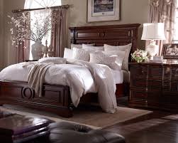 Decor a small farmhouse master bedroom with green wreath look how the green wreath hung above the bed adds contrast color to the scheme. Bedrooms With Dark Wood Furniture Novocom Top