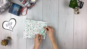 2) place your paper face down on your table. How To Make A Gift Bag From Wrapping Paper Tutorial