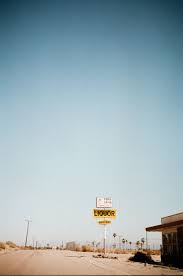 For example, in a wide shot of a man standing in an empty field, the sky, ground, and everything in between would be considered negative space. The Use Of Negative Space In This Photo Further Illustrates The Abandoned Loneliness Of This 35mm Photography Negative Space Photography Film Photography 35mm