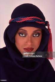 Close-up portrait of model Gay Thomas, in a hooded top wrapped with a...  News Photo
