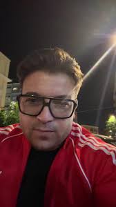 Nighttime Urban Style in Red Adidas Jacket