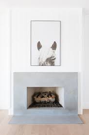 They really lightened the room up by painting the brick and wood trim + shelves a nice, bright white and then added the shiplap above the make it look nice and finished. Shiplap Fireplace Wall Design Ideas