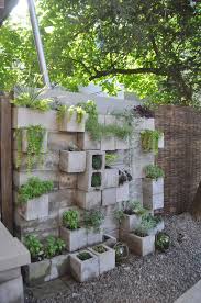 Budget Backyard 10 Ways To Use Cheap Concrete Cinder Blocks Outdoors Cinder Block Garden Apartment Garden Budget Backyard