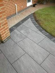 Pin By Emily Smith On Patio Garden Slabs Patio Garden Design Outdoor Tile Patio