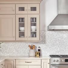 Protect your kitchen and bathroom walls with backsplash tiles. Merola Tile Conchella Penny White 11 1 4 In X 11 5 8 In X 2