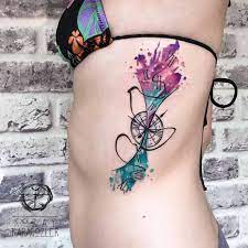 Tribal tattoo has gone beyond its traditional meaning. Watercolor Pocket Watch Tattoo On Side Rib Cage