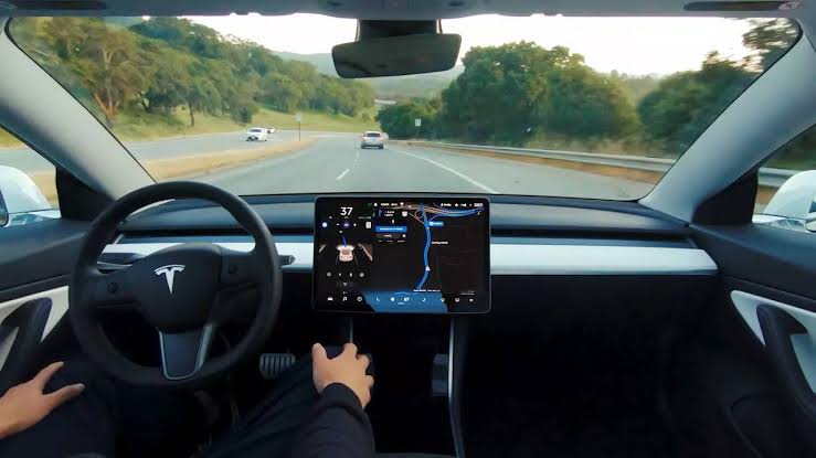 Tesla autopilot now allows drivers to play video games in moving car, raises safety concerns