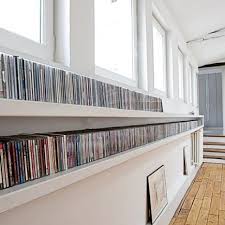 Consider positioning a long coffee table directly in front of the sofa. Modern Dvd Storage Ideas On Foter