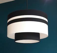 The bedside lamps can also be the right occasion for furnish the bedroom adding a decorative elements. Double Suspension Noire Et Blanche Sur Www Adc Abatjour Com