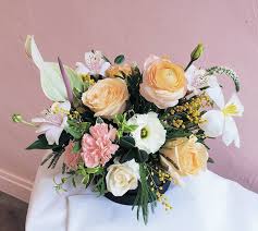 This Arrangement Is The Epitome Of Spring With Those Blooming Rananculus And Dancing Tulips And Those Spring Arrangements Flower Arrangements Flower Delivery