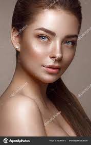 Beautiful young girl with natural nude make-up. Beauty face. Stock Photo by  ©kobrin-photo 190495872