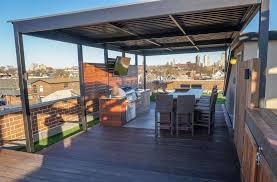 Early american and beach sand deck. Rooftop Deck With Outdoor Kitchen Tv Denver Roof Decks Pergolas And Outdoor Living Spaces