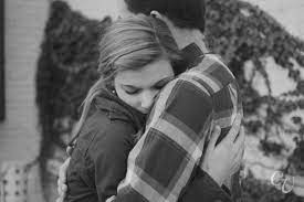 Kyle Corinne Milwaukee Third Ward Engagement Session Boyfriend Girlfriend Pictures Romantic Hug Hugging Couple