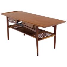 View all items from home furnishings, housewares, décor & more sale. Danish Modern Teak Coffee Table Cane Shelf Rolled Edges 4 Storage Drawers For Sale At 1stdibs