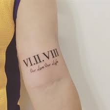 Inner bicep arm tattoo roman numeral. 49 Roman Numeral Tattoo Ideas Best Designs Canadian Tattoos