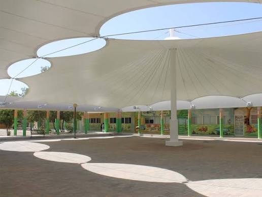 ArcShade engineering team reviewing a tensile structure plan in Delhi