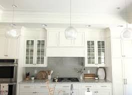 Running frameless cabinets to the ceiling with euro style cabs use a 5/8 starter strip at ceiling scribe it level. How To Fill Space Between Cabinets And Ceiling Caroline On Design