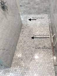 The primary goal of the shower base is to create a sloped floor angled toward the drain so the waste water flows efficiently into the pipes. Carrera Tile Shower Floor With Large Gray Area Ceramic Tile Advice Forums John Bridge Ceramic Tile