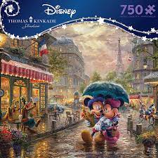 Proudly made in the usa by ceaco. Amazon Com Ceaco 750 Piece Thomas Kinkade Disney Dreams Mickey And Minnie In Paris Jigsaw Puzzle Kids And Adults Toys Games