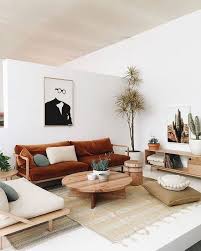 A Japandi Living Room With Whites And Light Colored Wooden Furniture Cognac Textiles And Sades Of Green For A Retro Home Decor Retro Home Living Room Designs