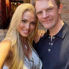 What anime show features a male character wearing a blue fur cape and  wielding a giant sword?