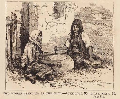 Two women grinding at the mill stock image | Look and Learn