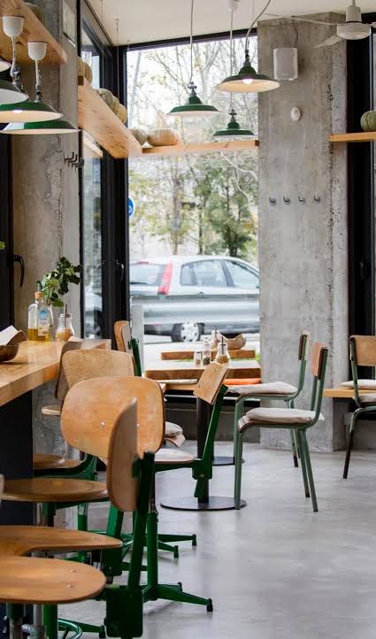 People working from a laptop-friendly cafe