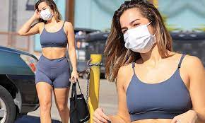 Addison Rae puts her defined abs front and center in blue sports bra and  biker shorts | Daily Mail Online