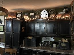 Primitive Above Kitchen Cabinets Decor With Black Cabinets Cow Kitchen Decor Primitive Kitchen Decor Decorating Above Kitchen Cabinets