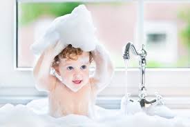 A stack of clean washcloths; Teaching Your Kid To Take A Bath Baby Bath Moments