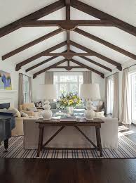 This design proposal suggests a black and white color scheme with a touch of wood. Interior Large Image Vaulted Ceiling Living Room Farm House Living Room Modern Farmhouse Living Room