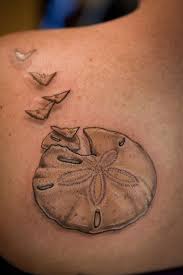 Pin By Mercedes Martinez On Tattoos Dollar Tattoo Sand Dollar Tattoo Starfish Tattoo