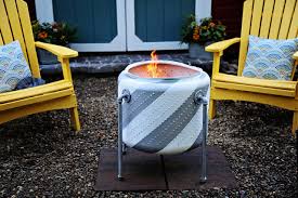 The key to a smokeless fire is having extra oxygen supply. How To Turn An Old Washing Machine Drum Into A Firepit Hgtv