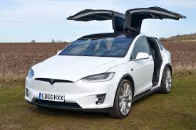 I've opened my doors about 30 times in my garage and only once it actually came in contact with an obstacle. Tesla Model X Review The Ultimate Electric Suv