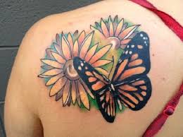 Maybe you would like to learn more about one of these? Butterfly On Flowers Tattoo On Girls Back Shoulder