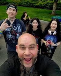 Vended guitarist meets young fan at concert