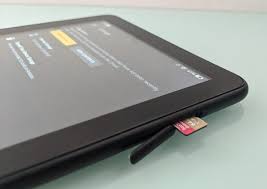 If the slot is on the side/edge of the device, you'll typically have to push it in to be able to pull out a tray. How To Use An Sd Card With Amazon S Fire Tablets Liliputing
