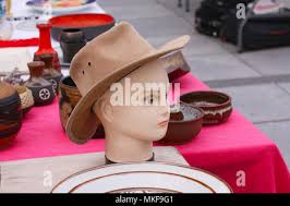 A stall of used clothes from flea markets that is right at the entrance to  the Daniel Atayde circus of the Ayarde brothers. Informal economy and daily  life the community of extreme
