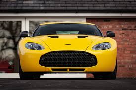 Image result for Sunburst Yellow 2012 Aston Martin